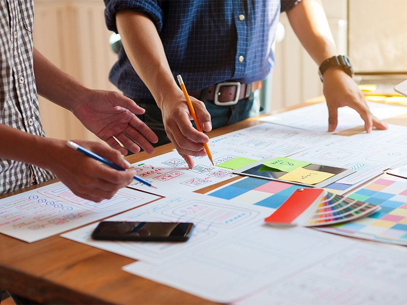 A photo of people deciding colors for a product