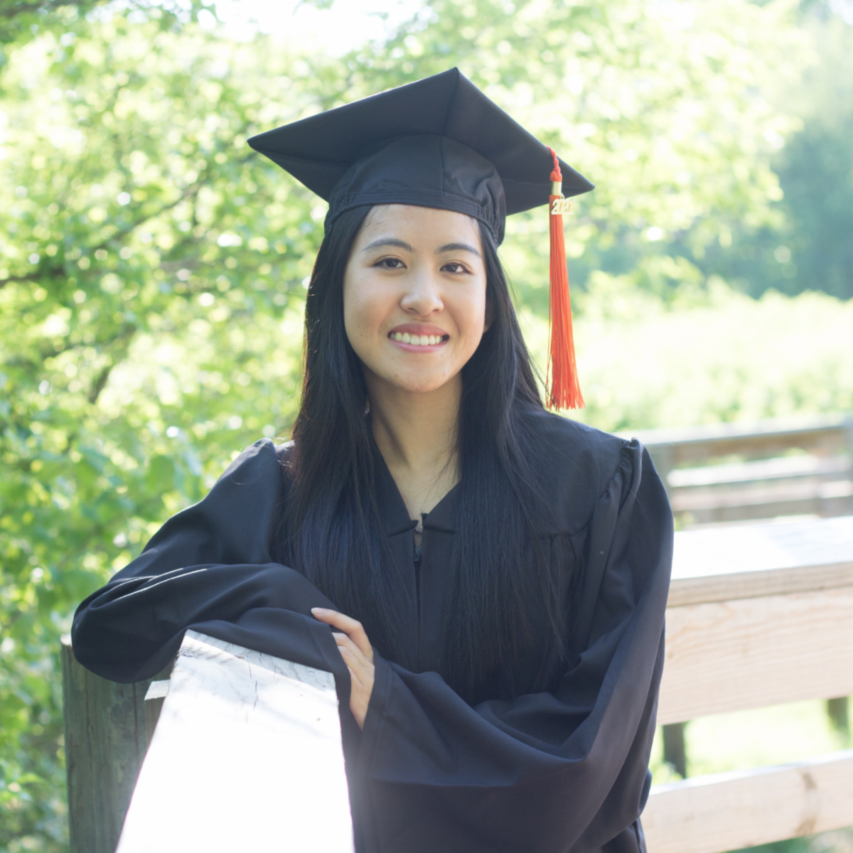Photo of Lucy Phoang ina graduation cap and gown