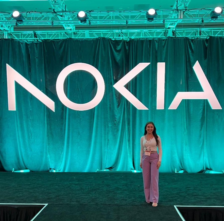 Photo of Alanna Do in front of a Nokia sign