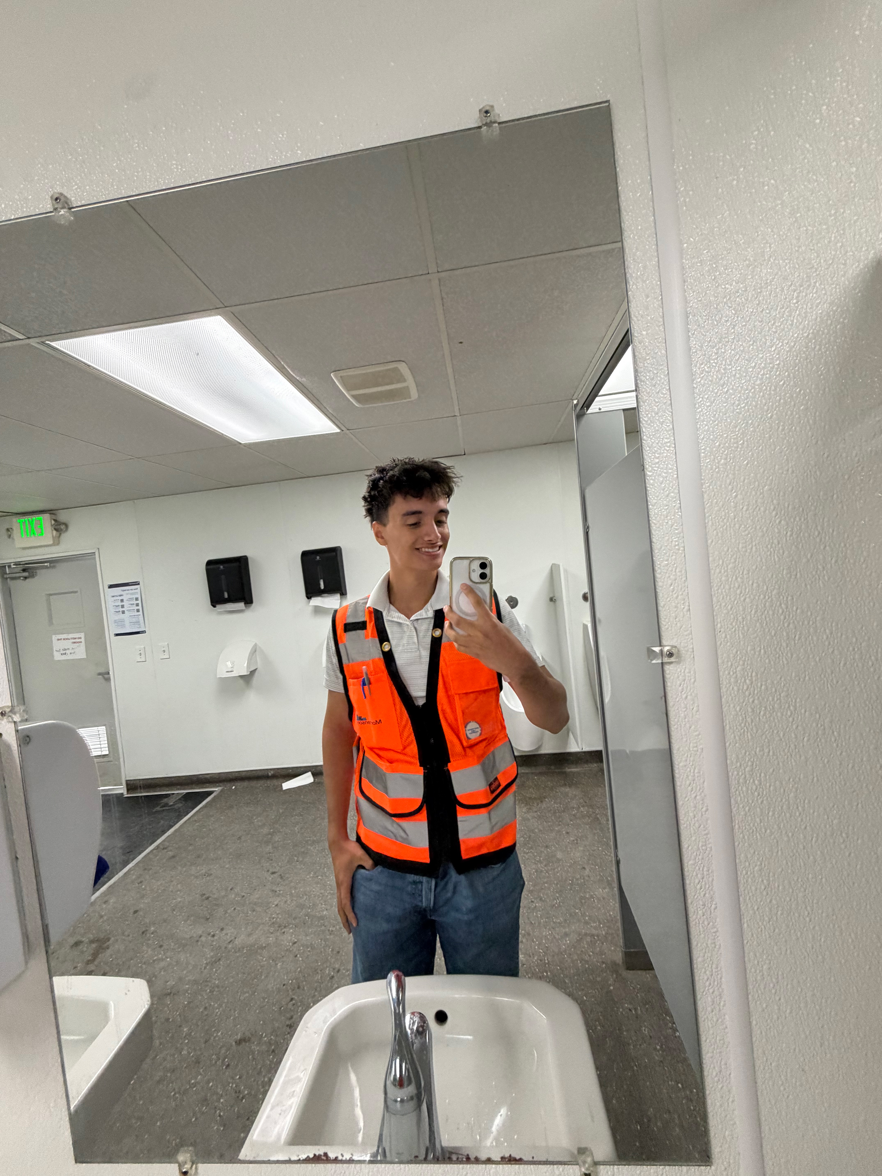 Selfie photo of Michael Boydo wearing an orange high-visibility vest