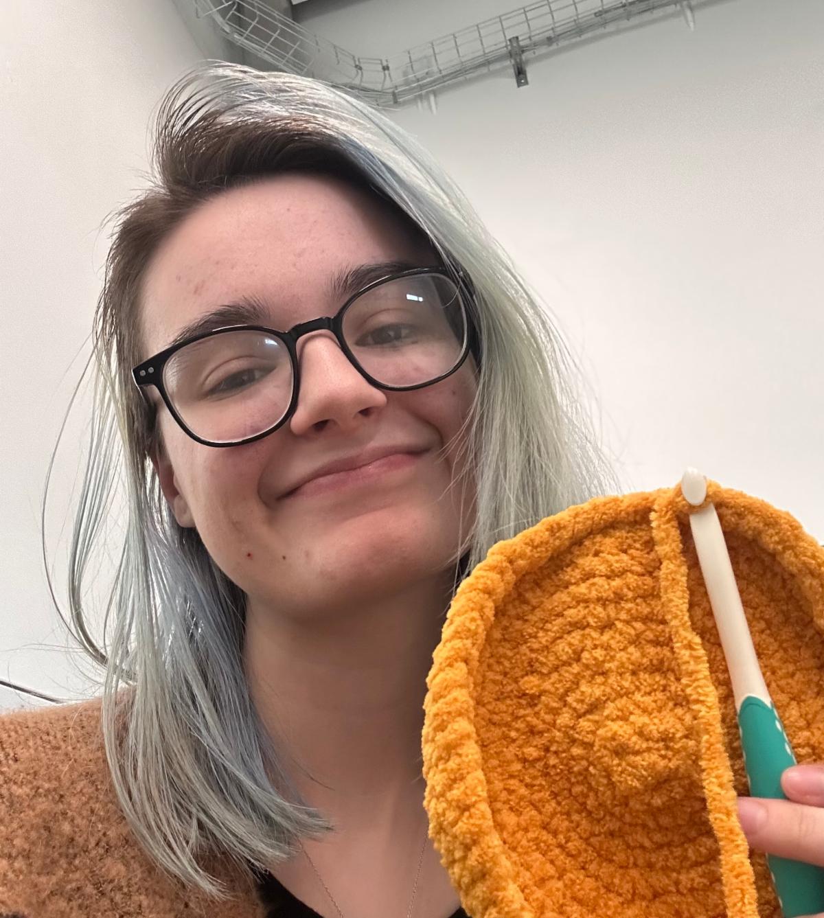 Photo of Ravyn Holden knitting