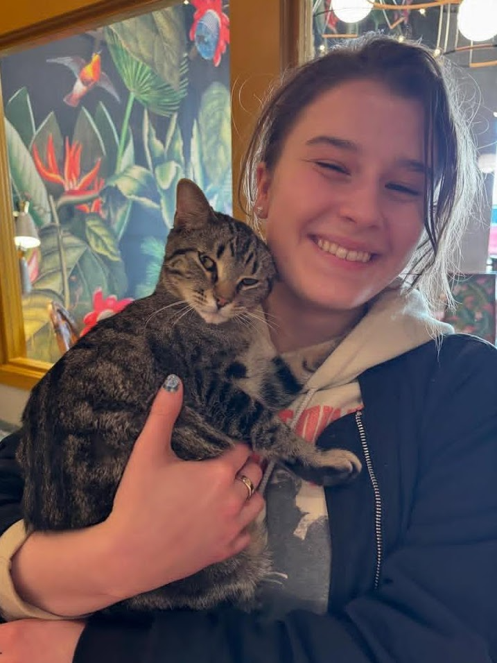 Photo of Marcie Schroeder holding a cat