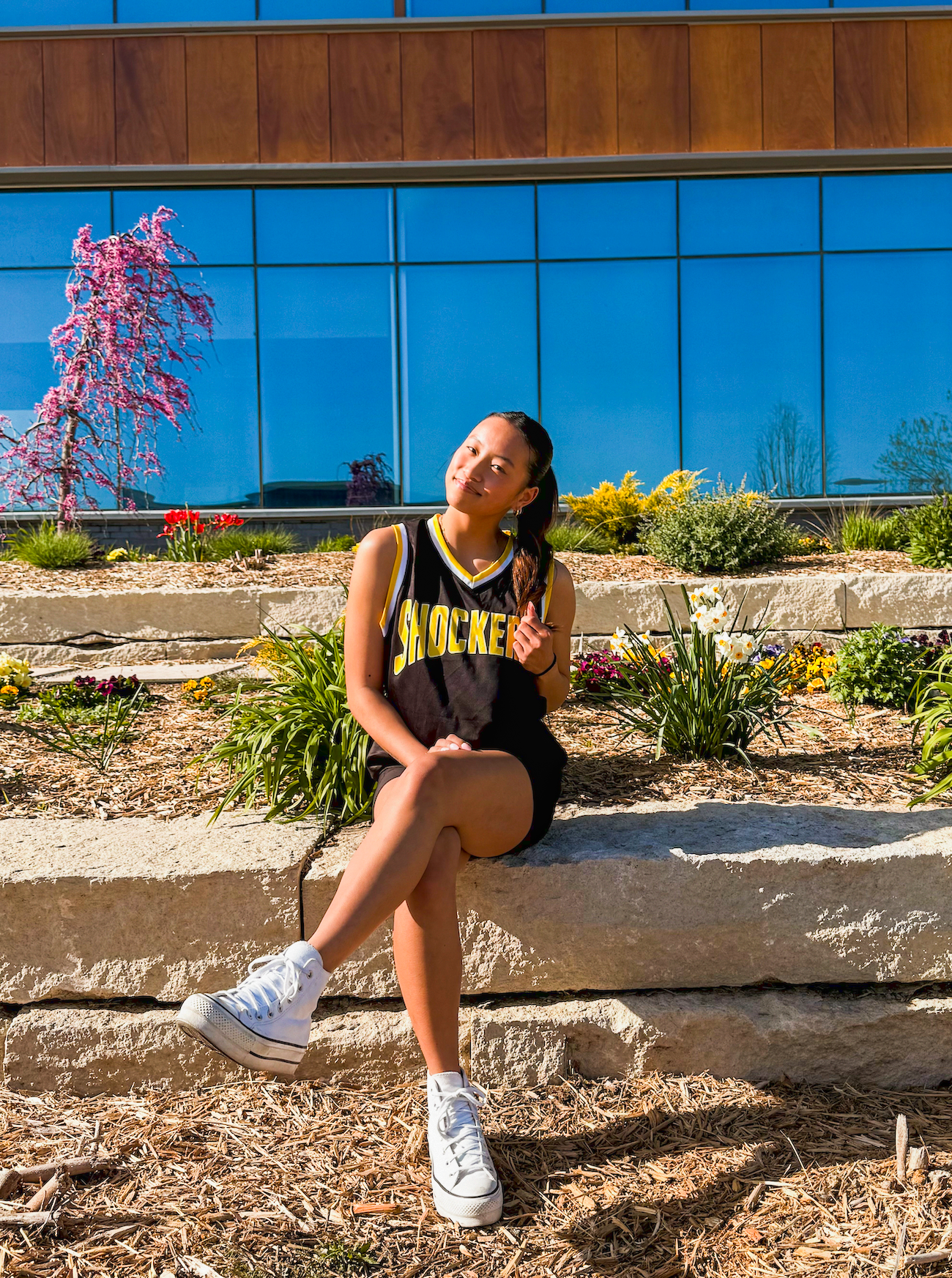 Photo of Emma Ewing outside in front of a university building