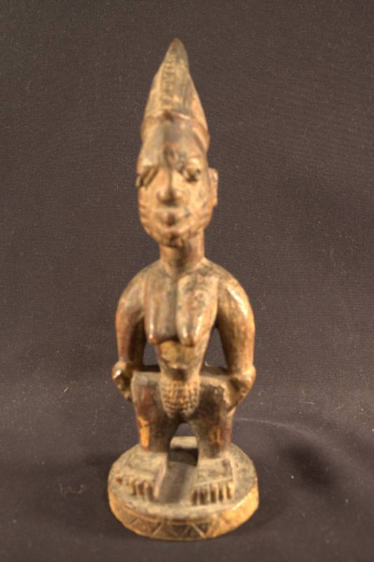 Wooden Figure Wooden figure of a female standing with hands on hips.