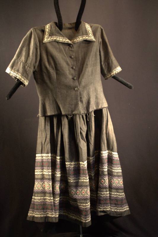 Jacket and Skirt Grey jacket and skirt with geometric design on the bottom portion of the skirt.