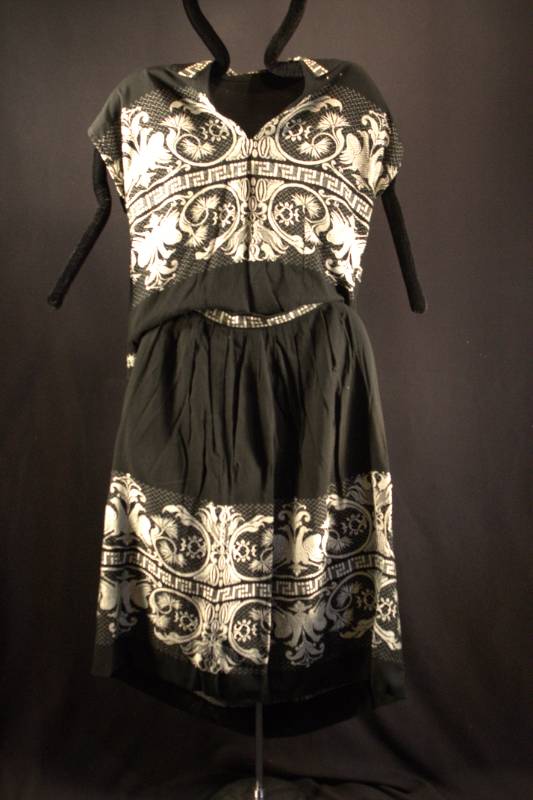 Shirt and Skirt Black shirt and skirt with white brocade pattern.