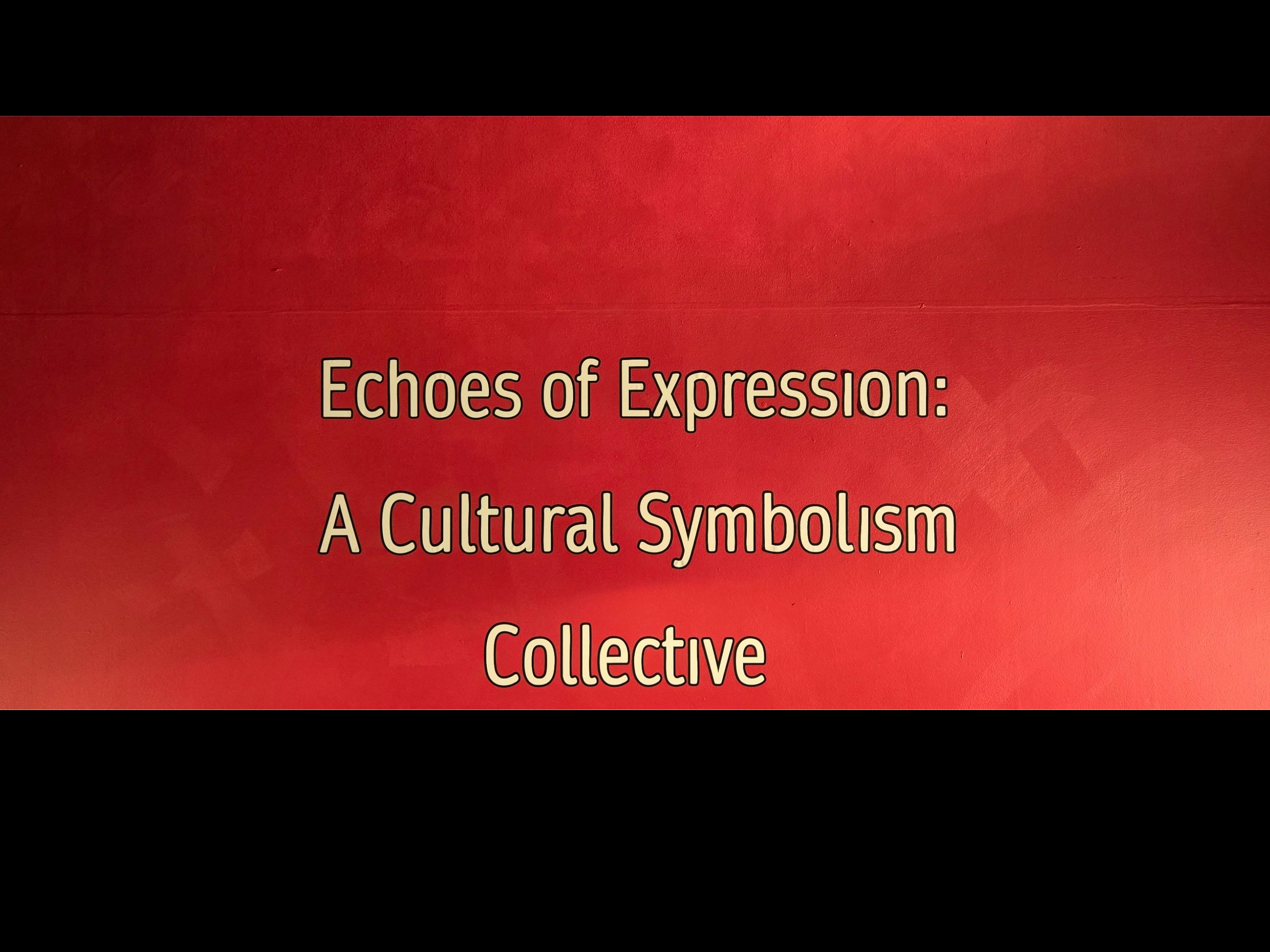Three displays in a museum gallery. Two of them feature clothing from around the world on a mannequin, while the other is a case with objects in it