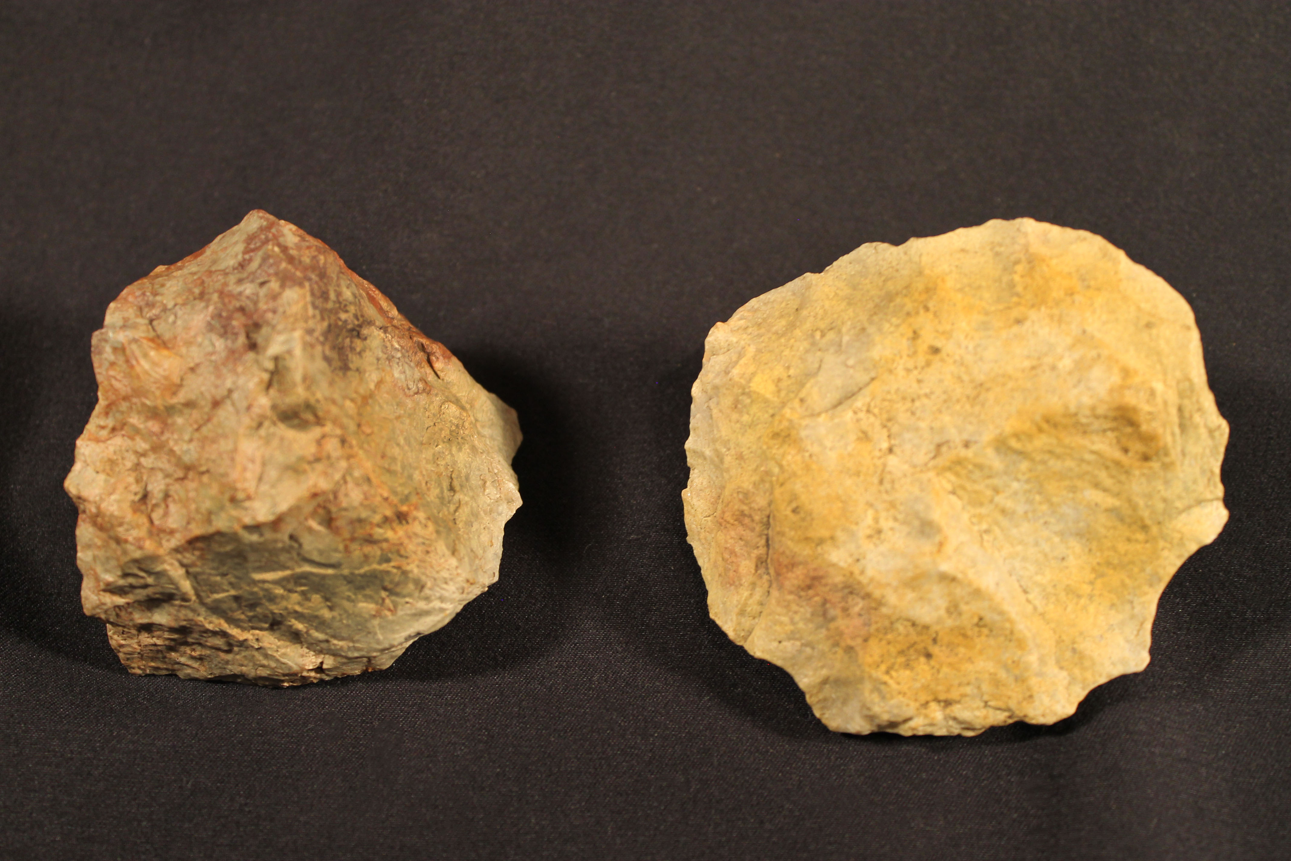 Two stones from which fragments have been removed