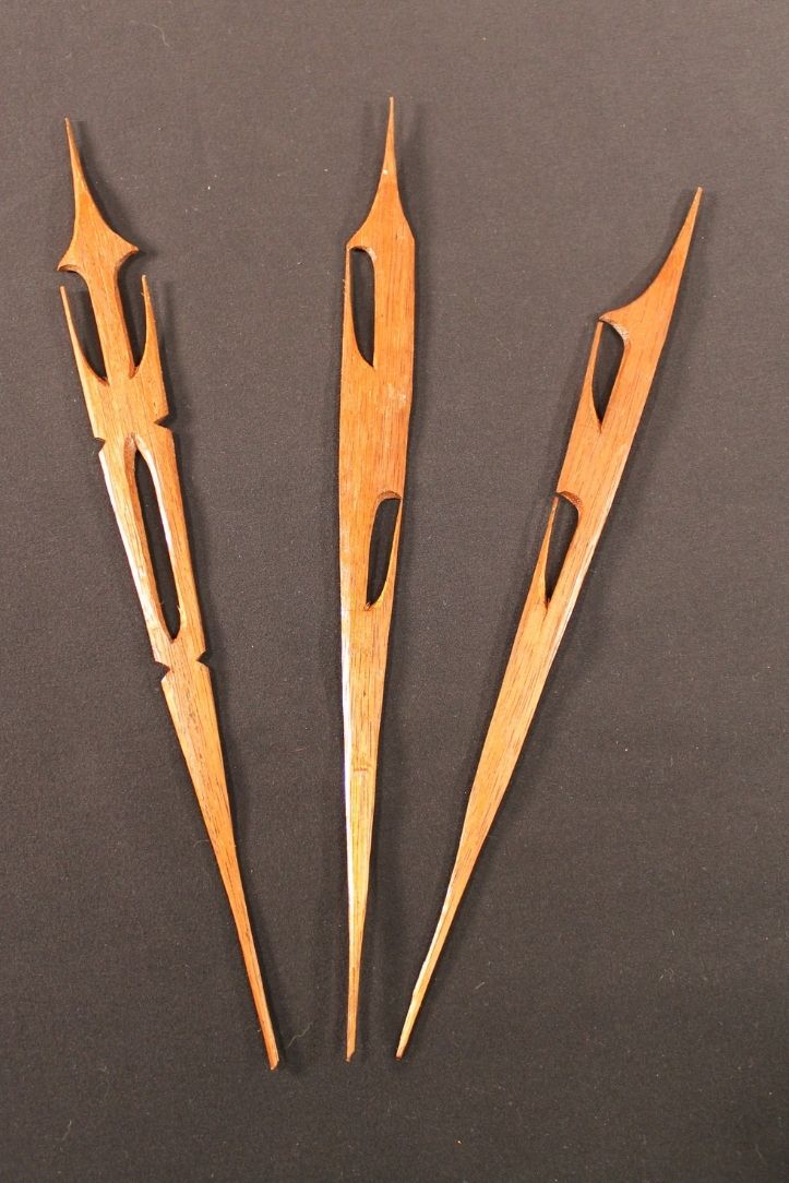 Three flat carved arrows.