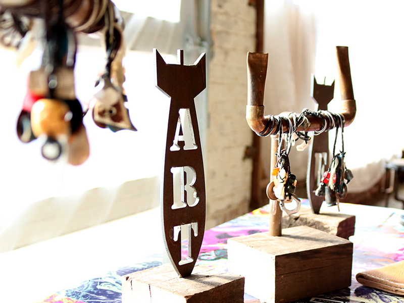 metal art and jewelry on wooden blocks metal art and jewelry on wooden blocks
