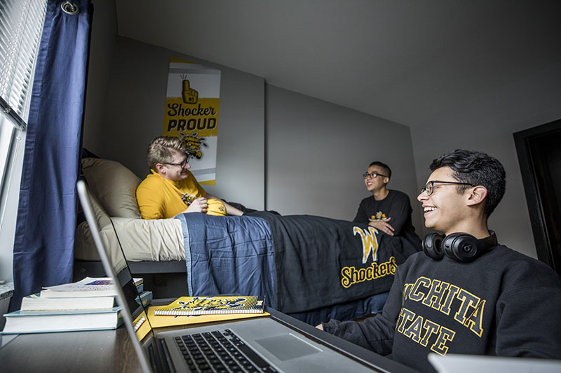Students hanging out in a dorm room