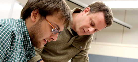 Teacher helping student