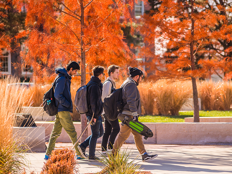 Group of Students Walking Across Campus