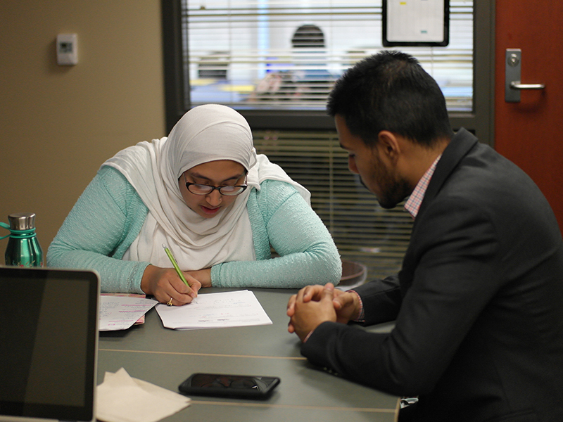 Tutor conducting a tutoring session with student.
