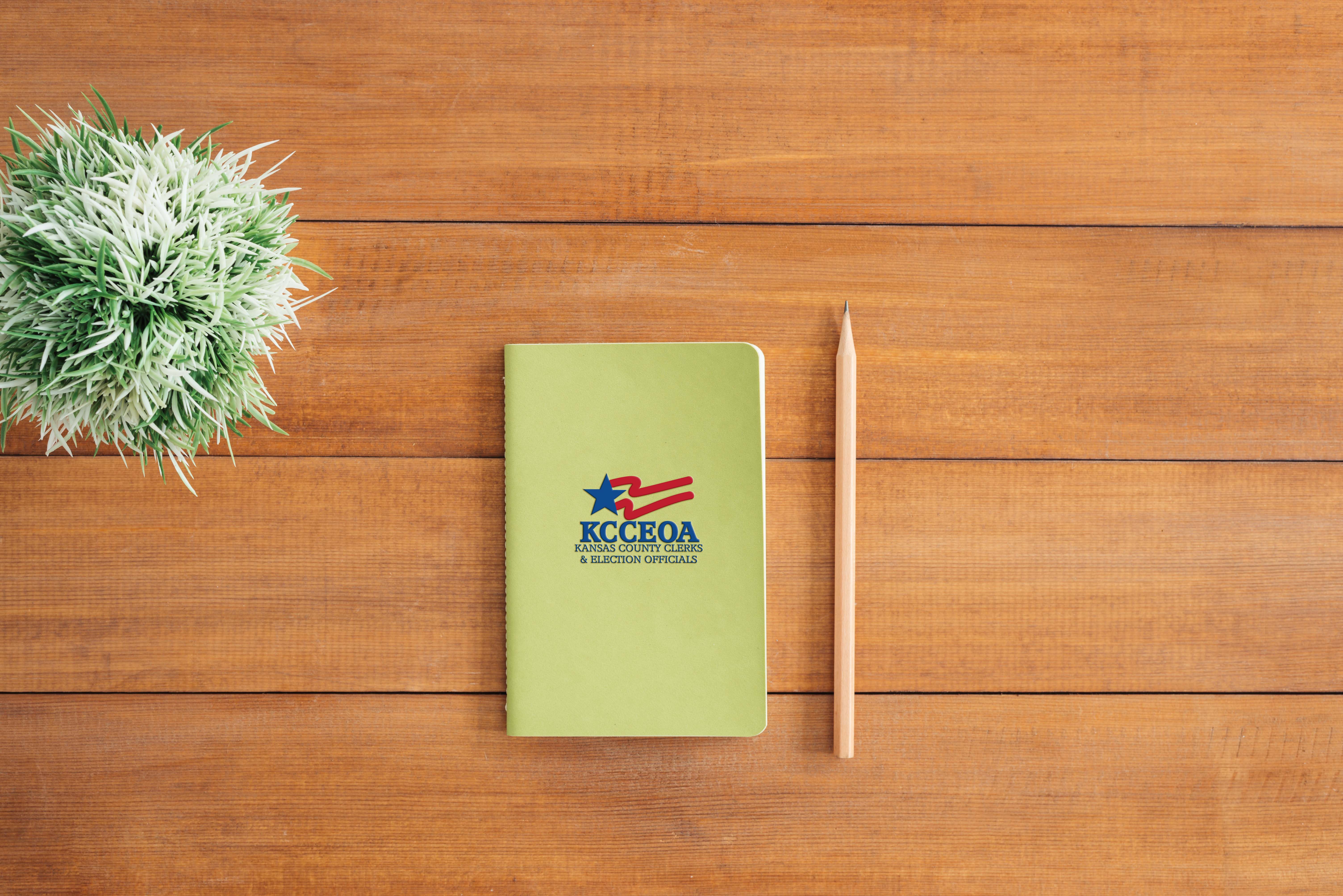kcceoa logo embossed on notebook