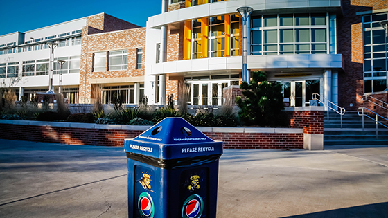 A recycling bin outside of the Rhatigan Student Center's north entrance