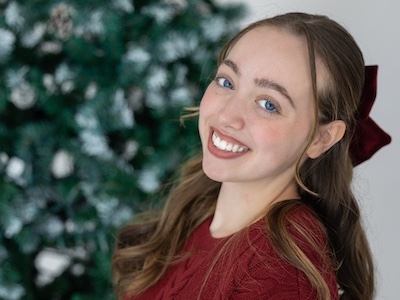 Lylah Covey Lylah Covey with a Christmas tree