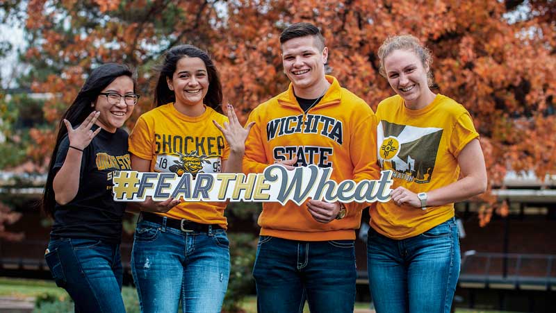 Students holding a Sign saying Fear the wheat