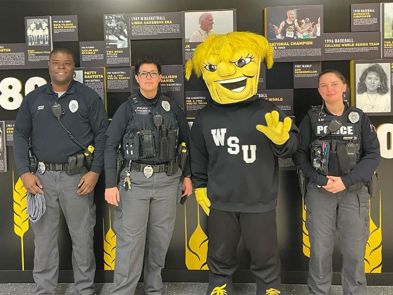 University Police taking a group photo with WuShock.