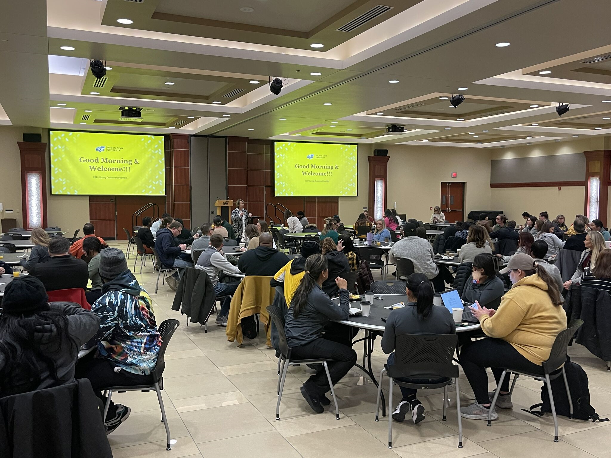 large crowd at a presentation