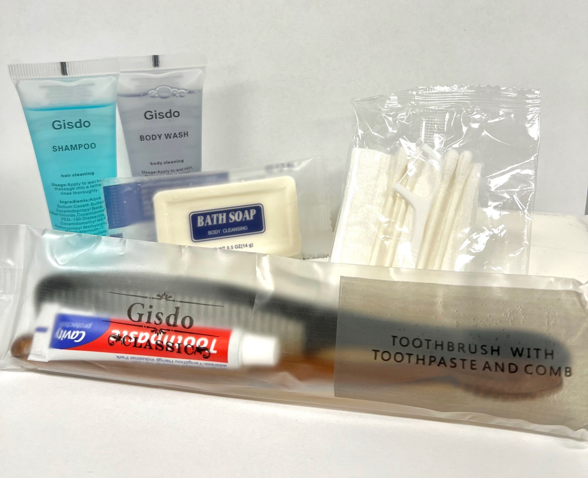 Hygiene kit tooth brush, shampoo, body wash, bar soap, q-tips, flosser, comb, washing cloth