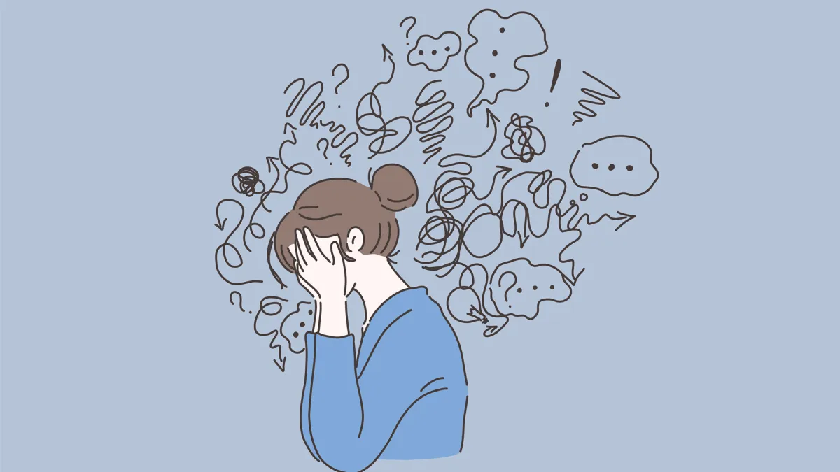 Woman stressed with head in her hands