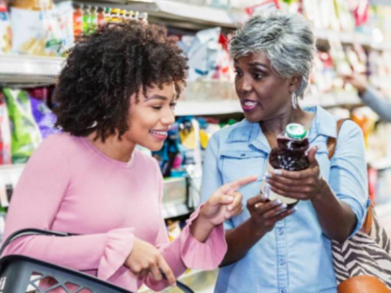 Shoppers looking at food labels