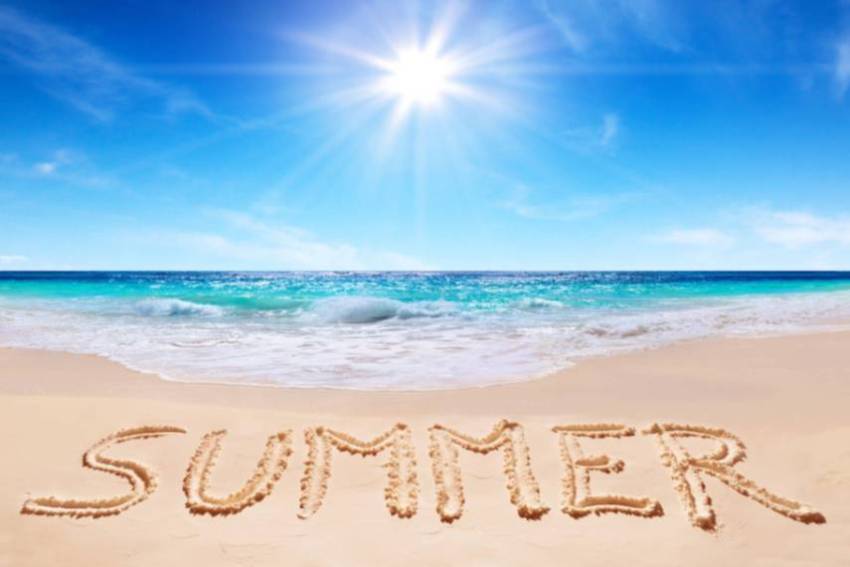 Summer beach beach with summer written in the sand