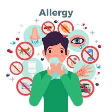 Illustration of a person sneezing with various allergy triggers around them, including dust, pollen, pets, insects, and food, each marked with a red 'no' symbol.