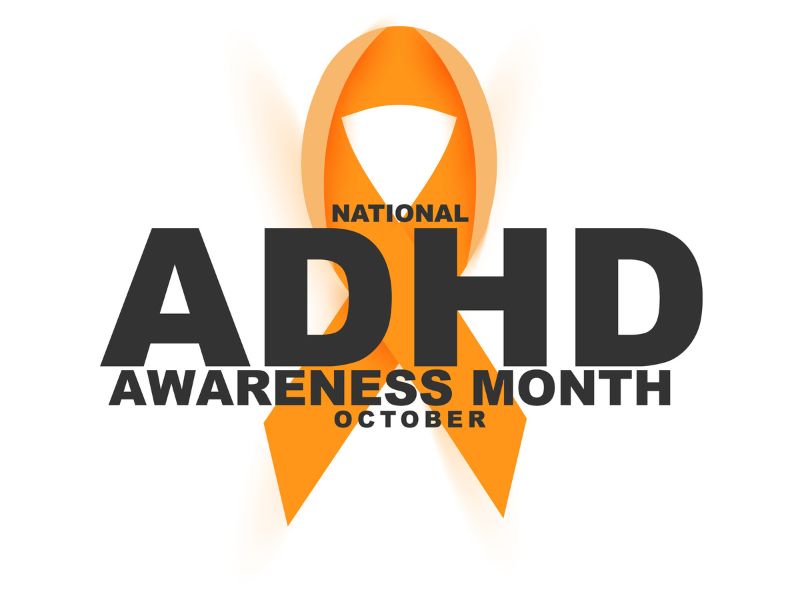 Orange ribbon symbol with bold text reading 'National ADHD Awareness Month October.'