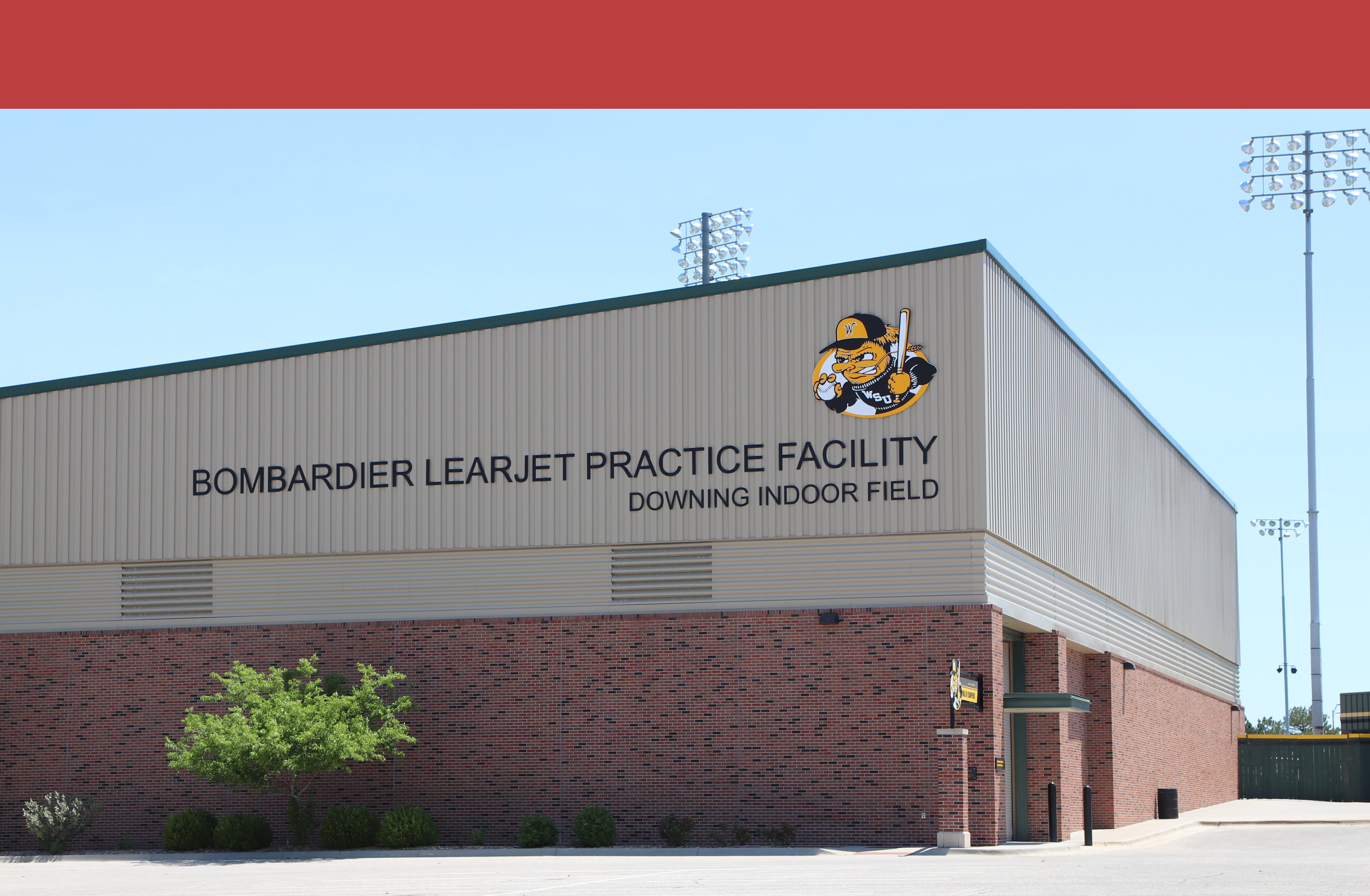 image of the side of the bombardier learjet practice facility. shows the baseball wu shock on the side.