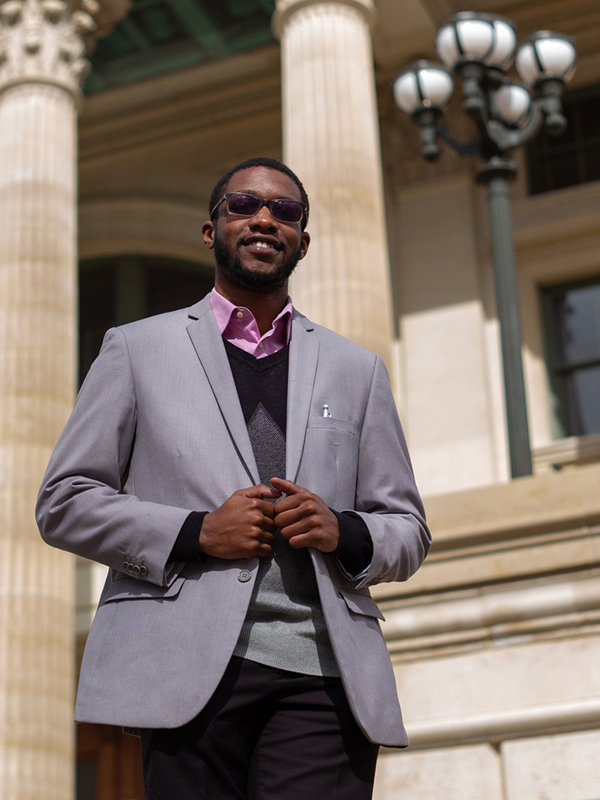 Harry Barthelemy stands outside a courthouse