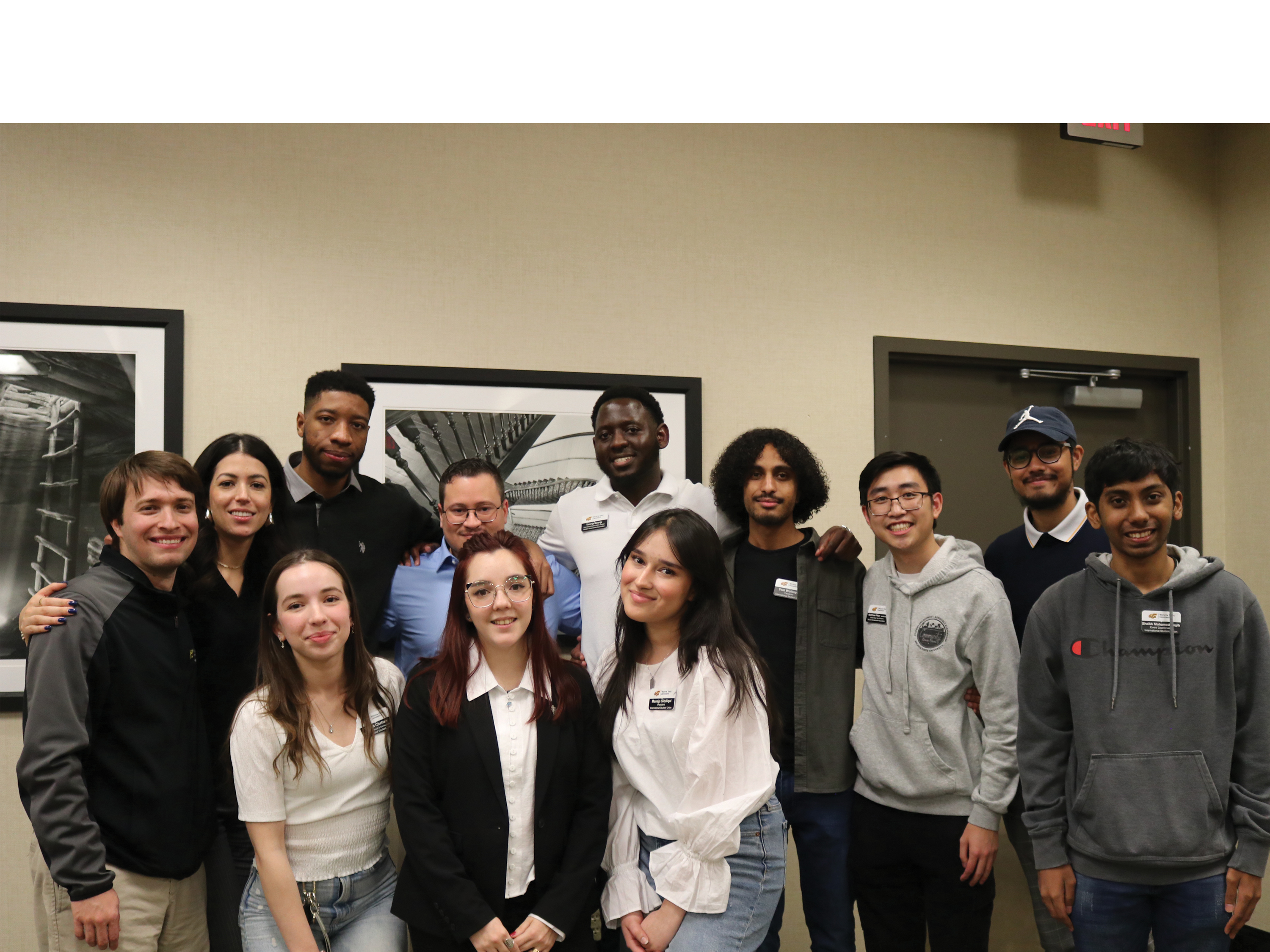 A group of Wichita State students and alumni pose for a group photo after an International Alumni Panel.