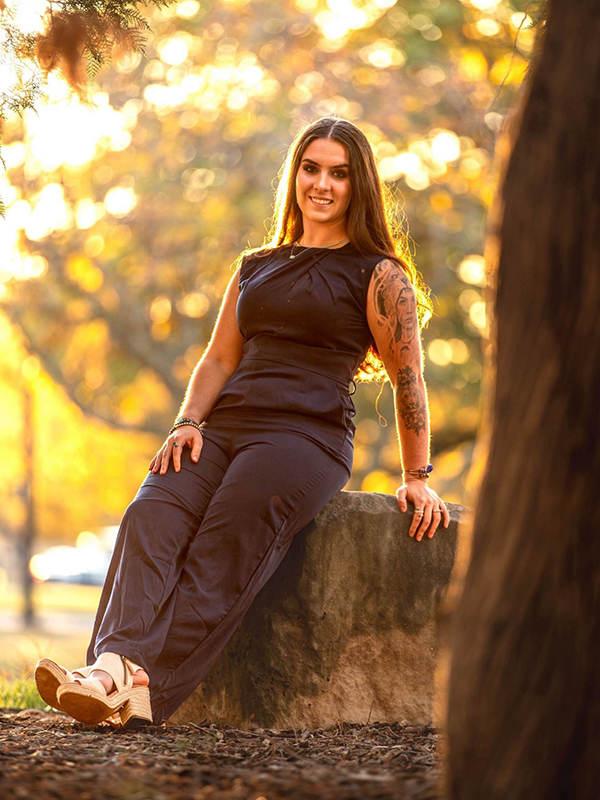 Bella Neish Bella Neish sits on a rock