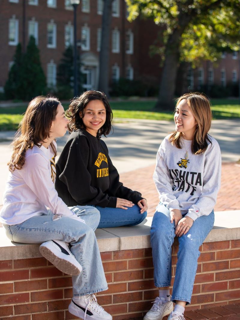 female students chatting outside