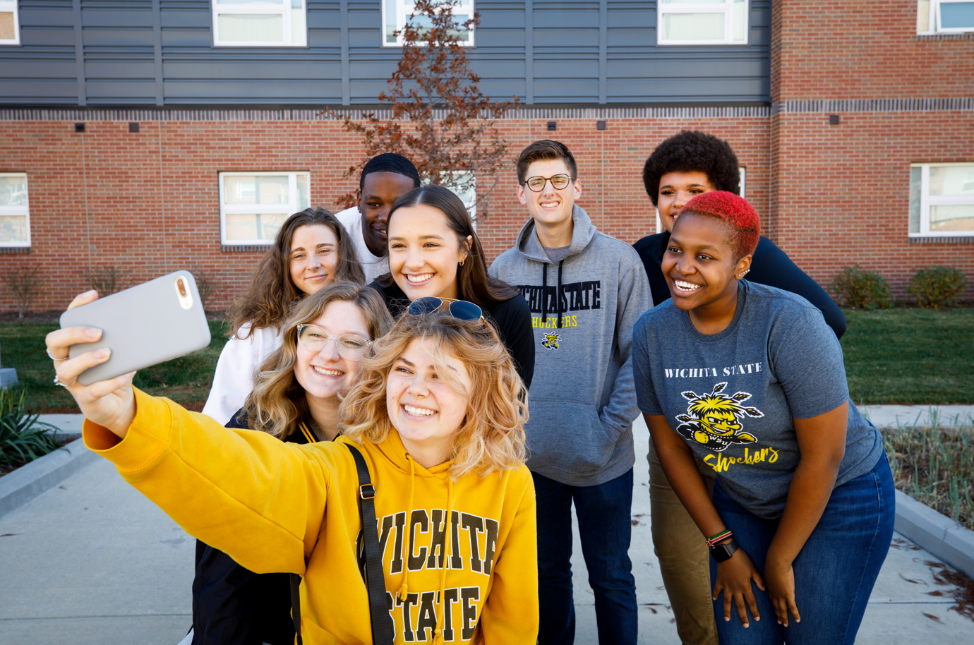 Students taking a selfie outside of the Suites