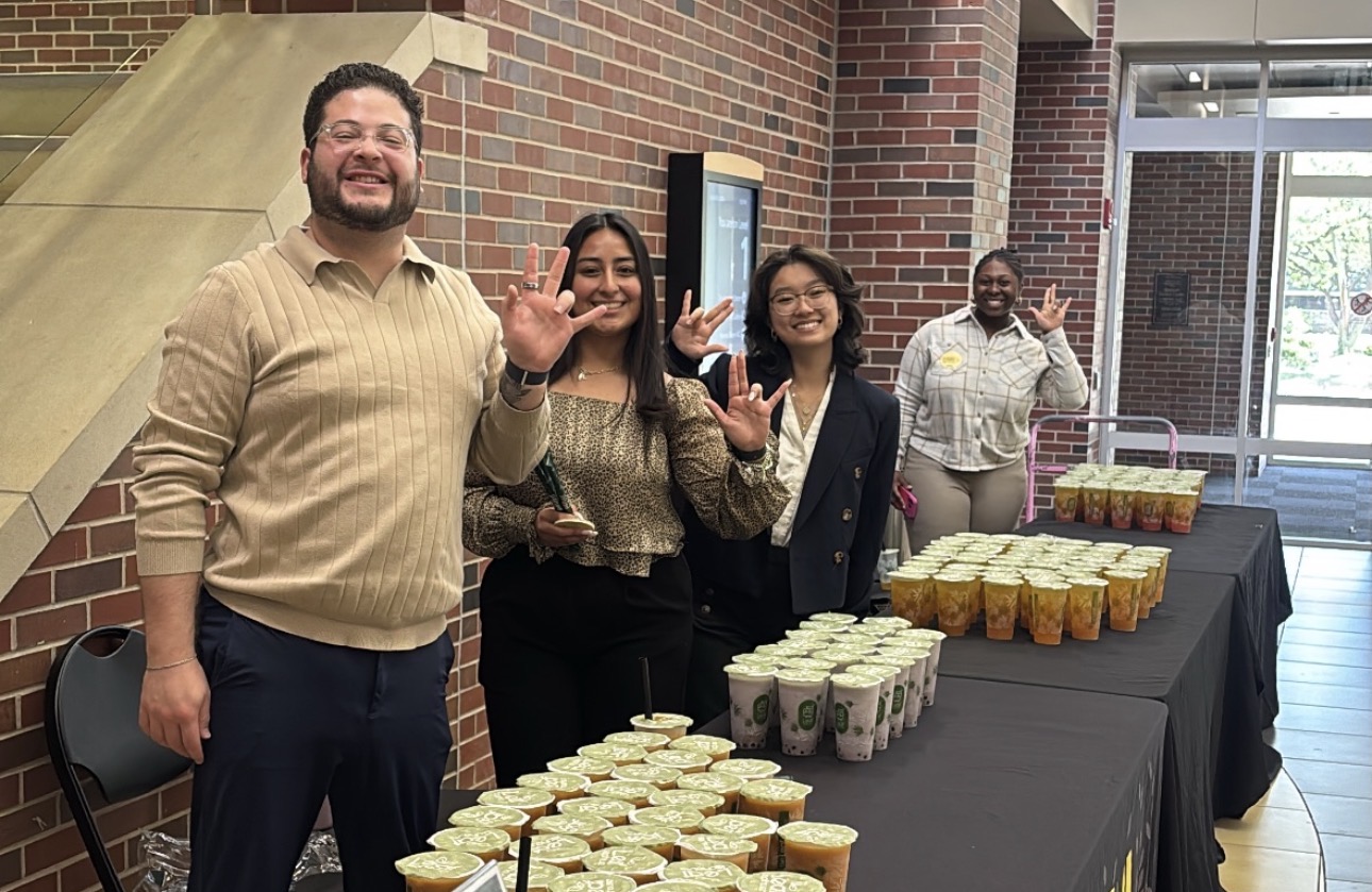 Advisor Fonseca, Chief Justice Hernandez, President Wang, and Advisor Nolen holding "Shockers" handsign standing with Boba