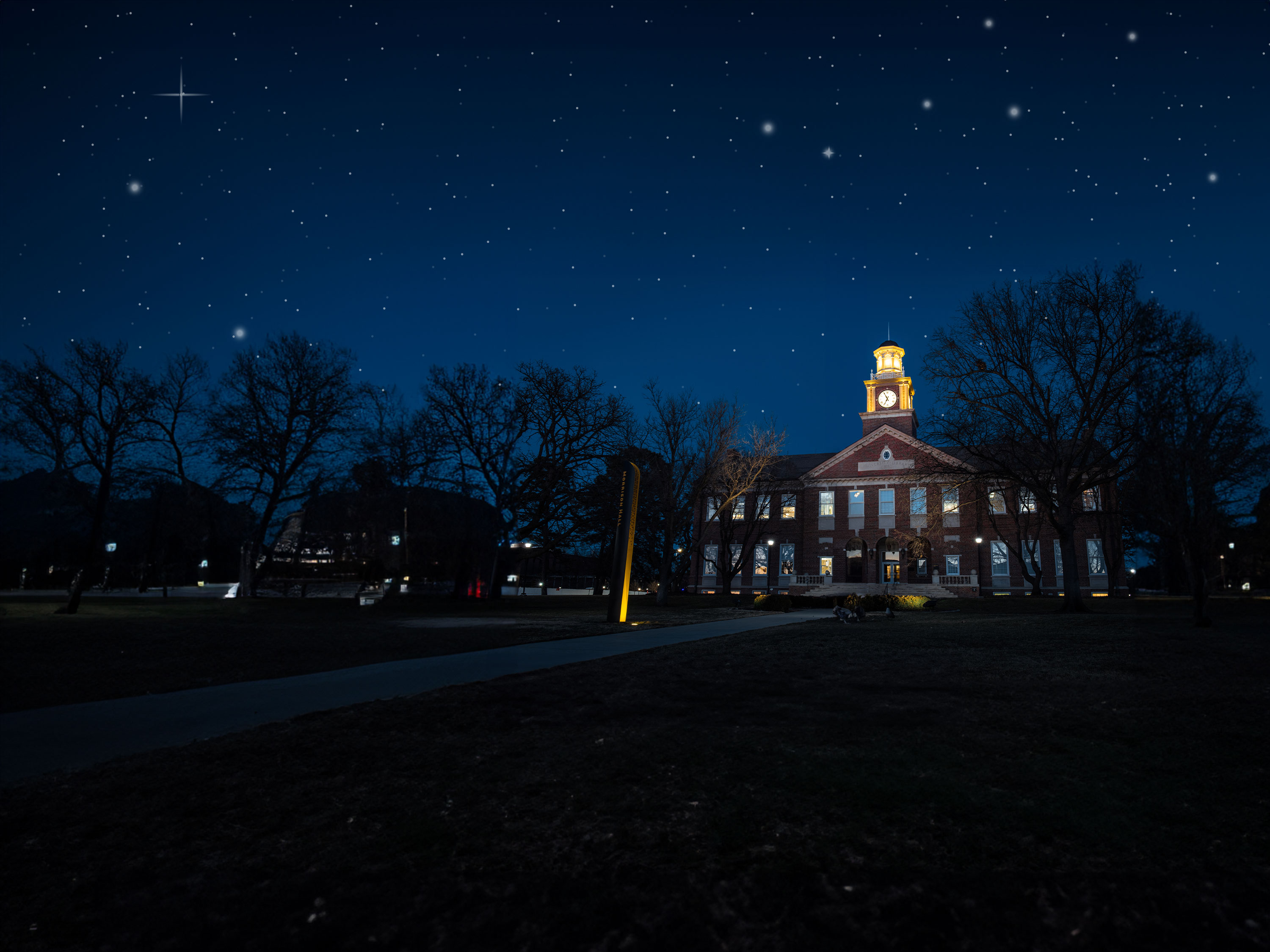View of the front of Morrison Hall at night.
