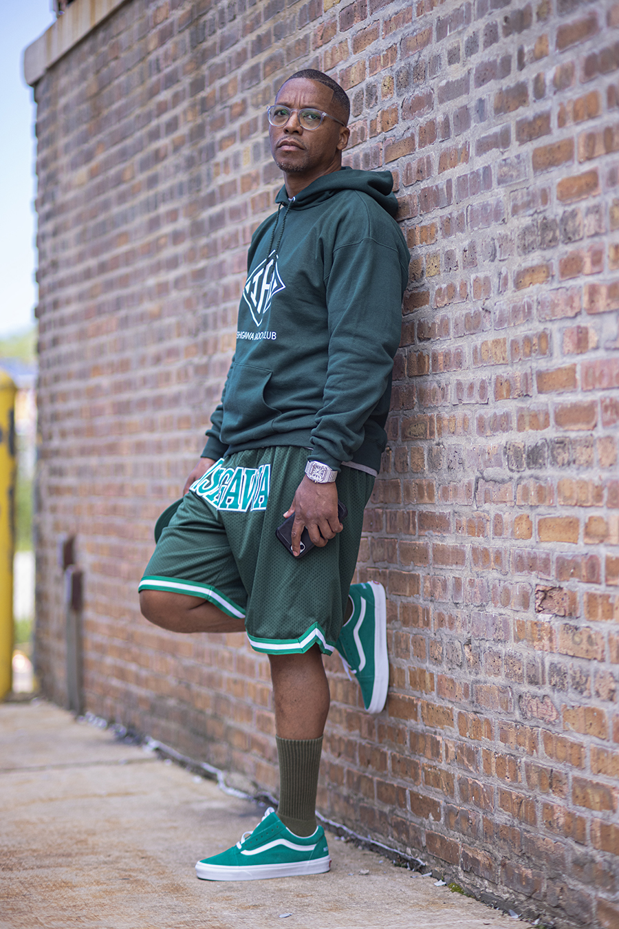 Lupe Fiasco Lupe Fiasco standing against a brick wall